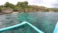 Boat outriggers moving through ocean waves